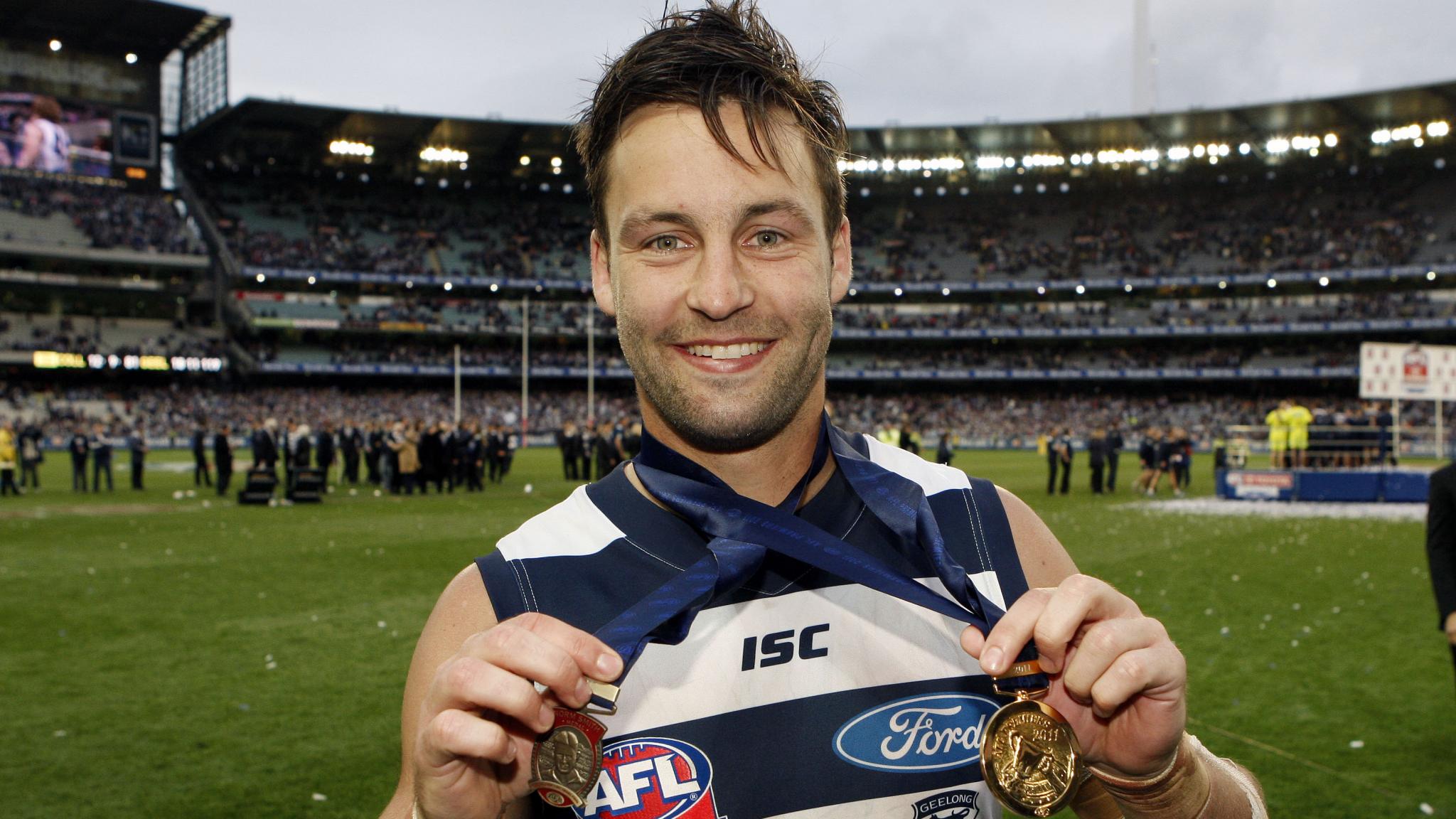 bartellandscape.jpg Jimmy Bartel with his Norm Smith and premiership medallions in 2011 - AFL,Grand Final,Jimmy Bartel,Fixture